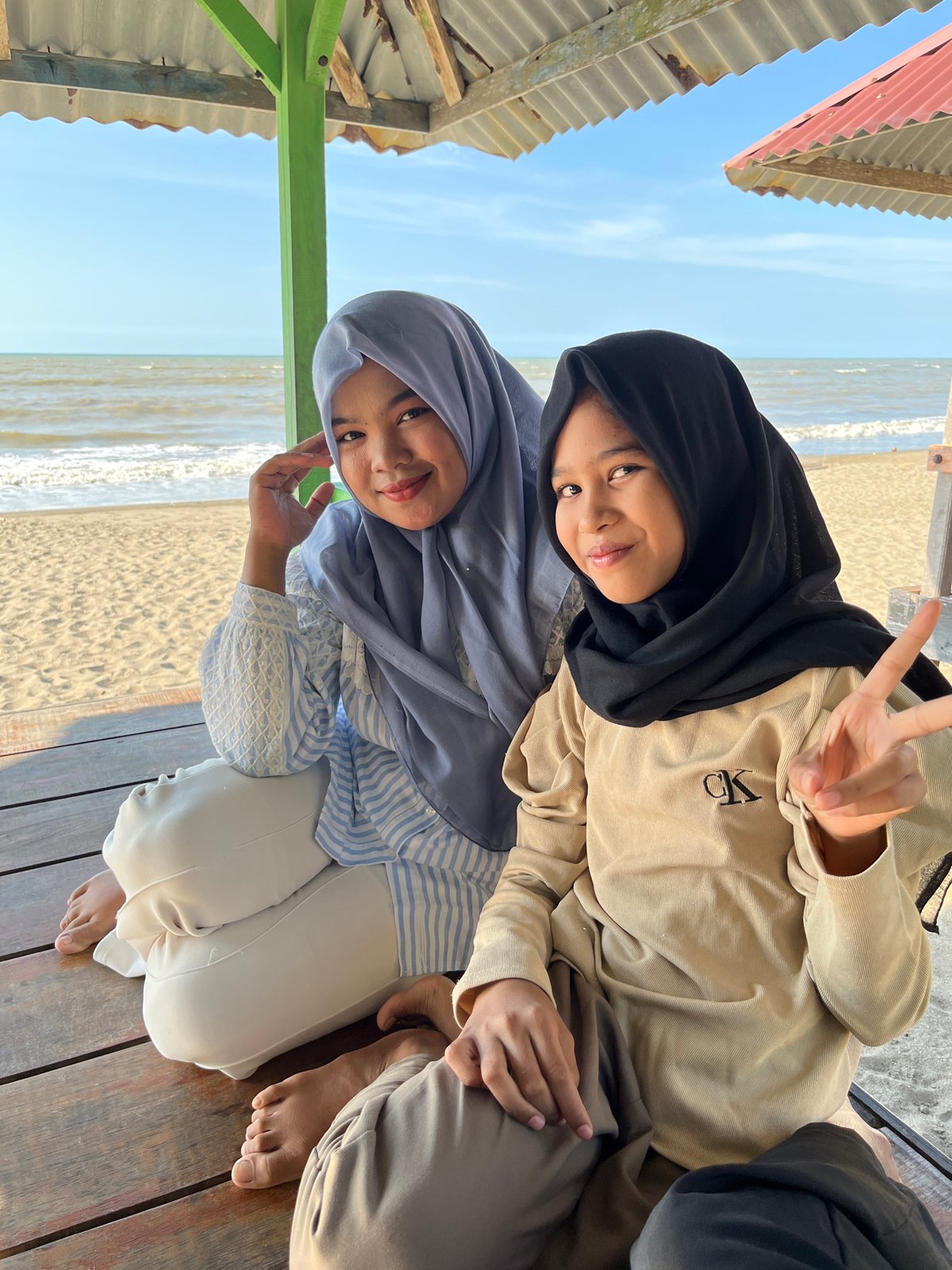 Relaxing on a sheltered wooden deck in Lhokseumawe