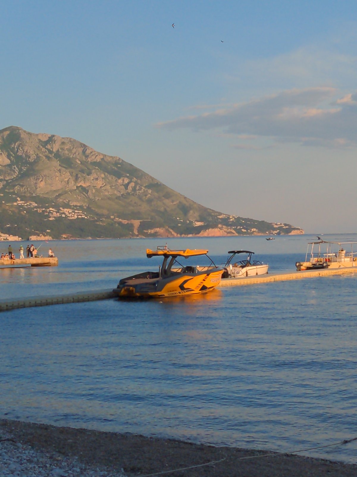 Coastal town captures afternoon recreational activities and street scenes