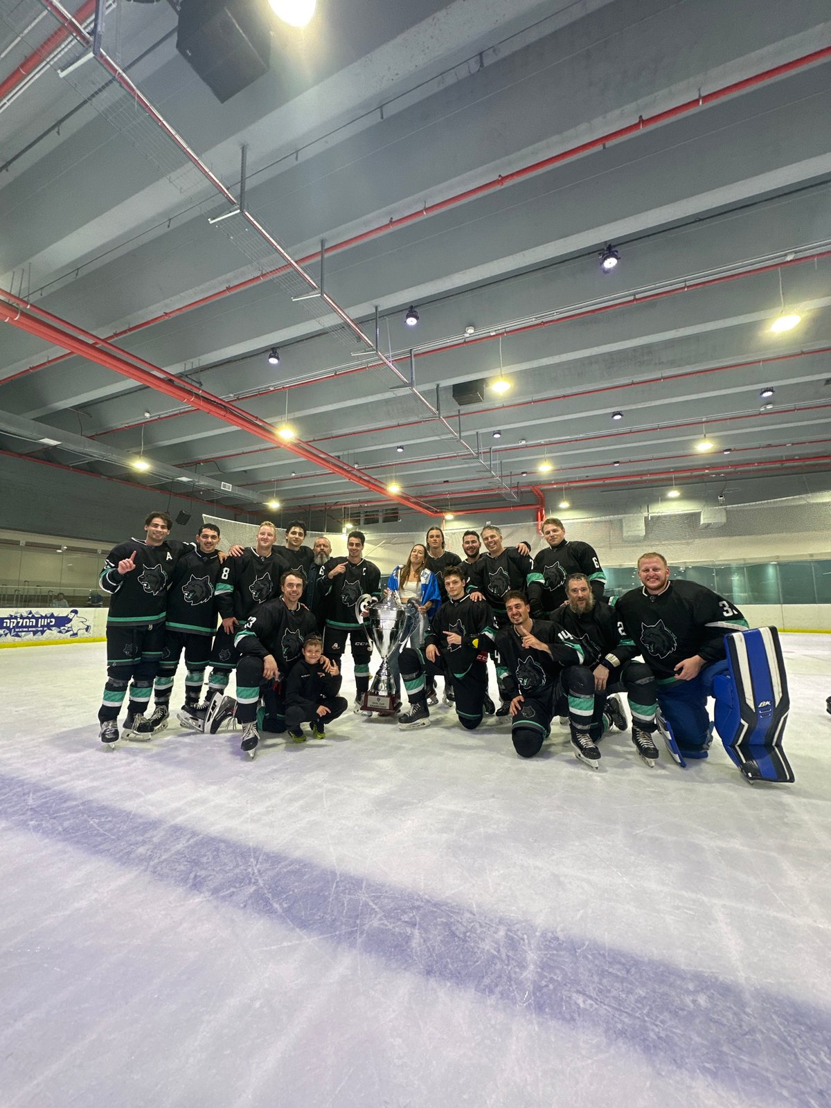 Hockey team celebrates 6–5 win with trophy on Ashdod ice