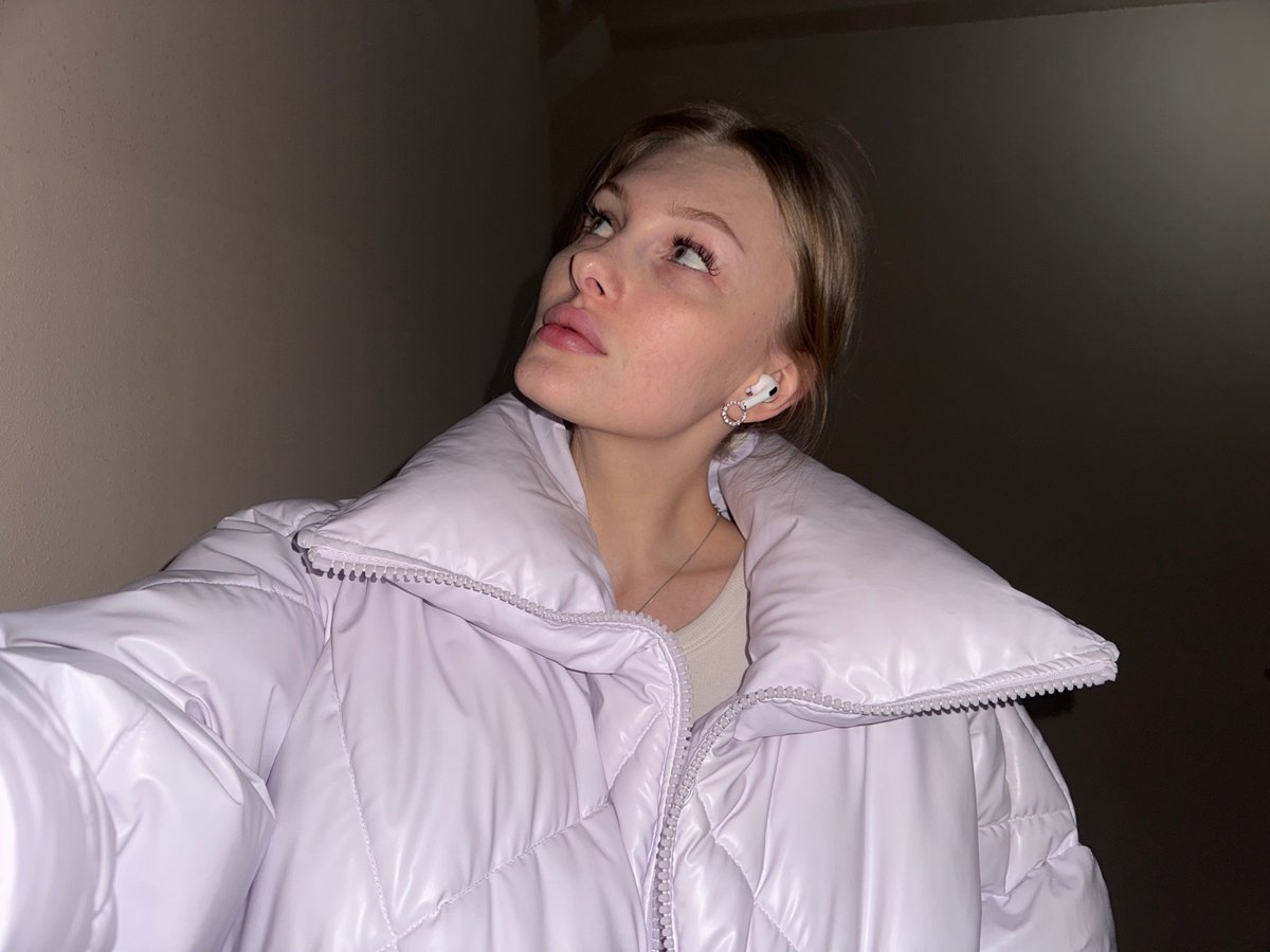 Woman takes multiple selfies indoors in Perm, Russia