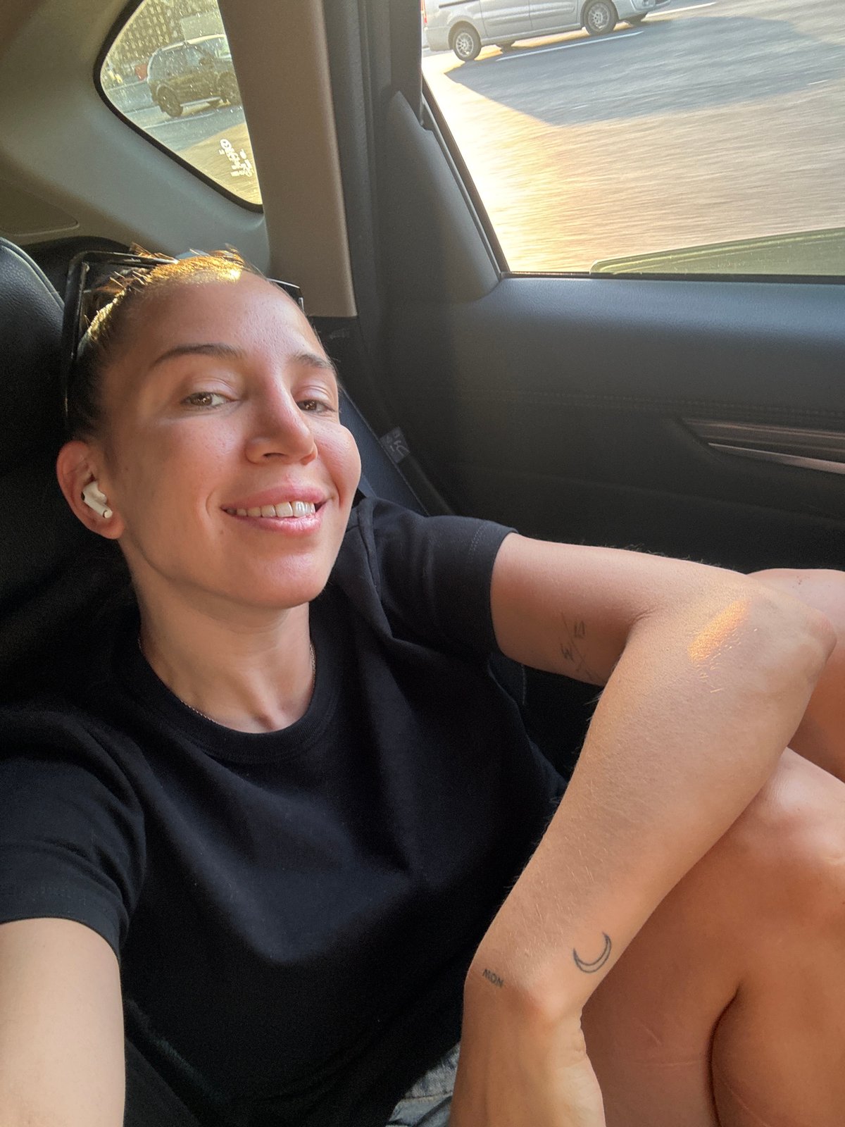 Woman smiles in passenger seat, Moscow vehicle sighting