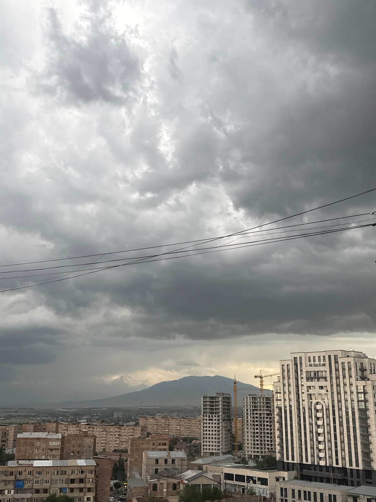 Abovyan under heavy skies: apartments, cranes, and mountain views