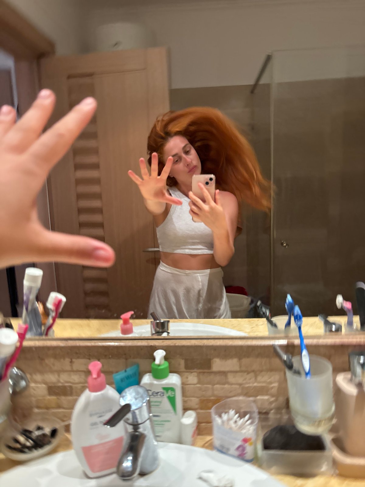 Woman takes bathroom selfies in Budva, Montenegro