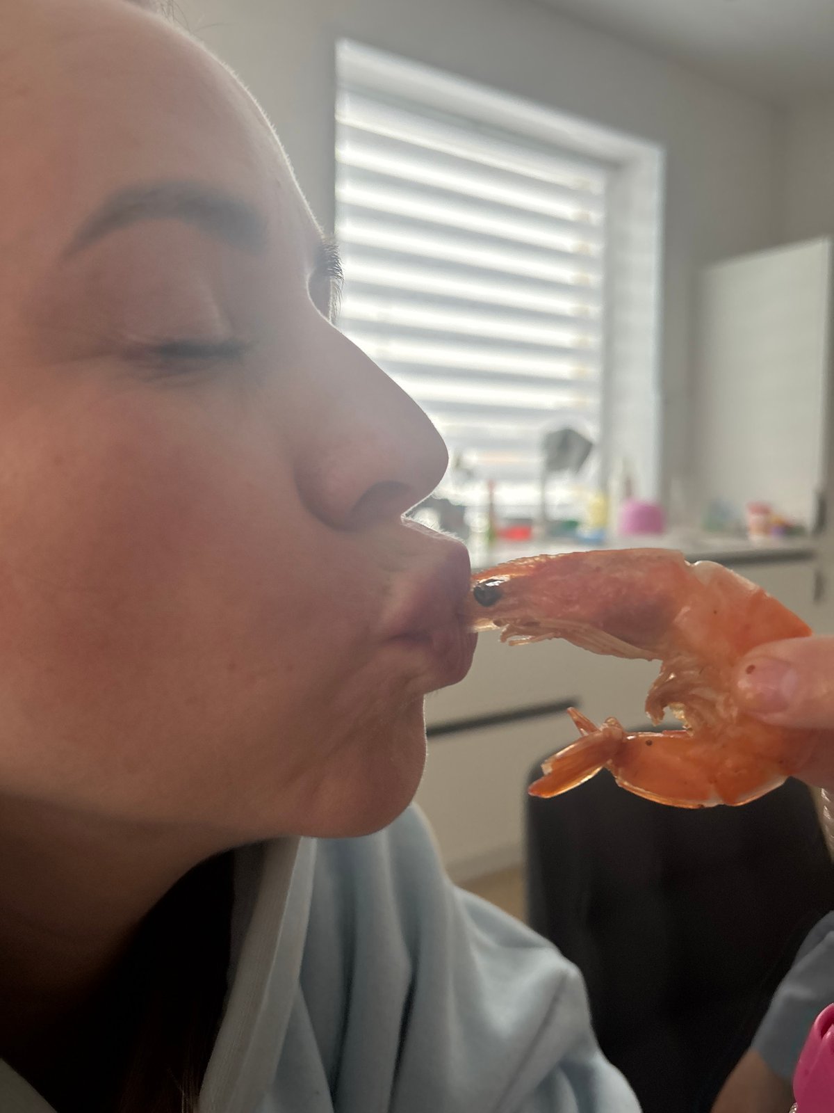 Indoor family gathering captured in Chaikovsky includes shrimp meal