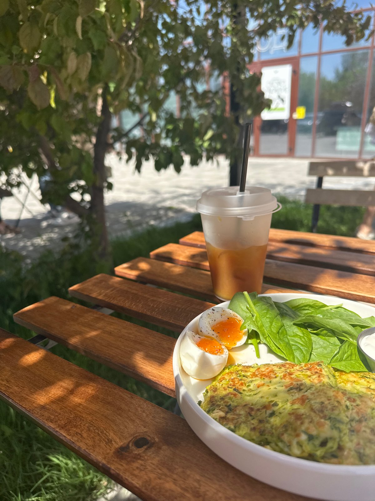 Outdoor meal documented on wooden table in Novosibirsk