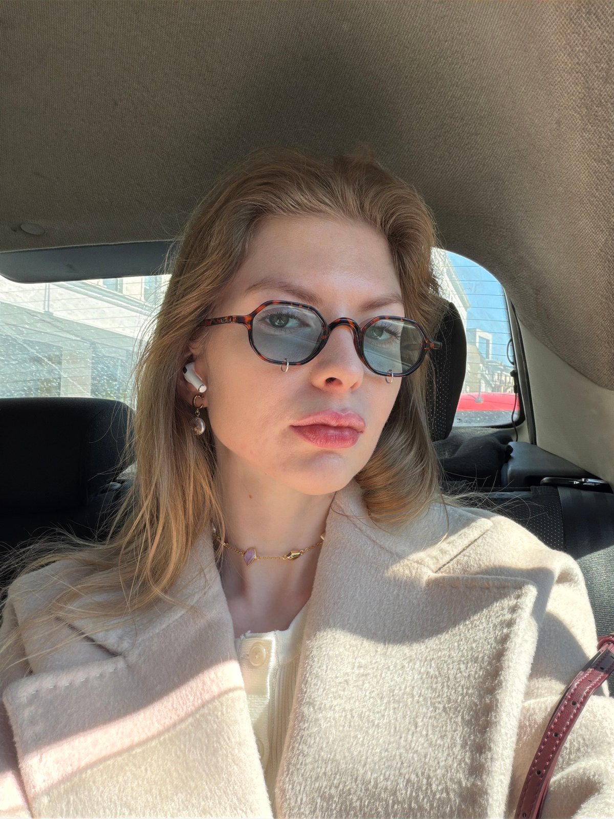 Morning street life captured across Moscow during sunny day