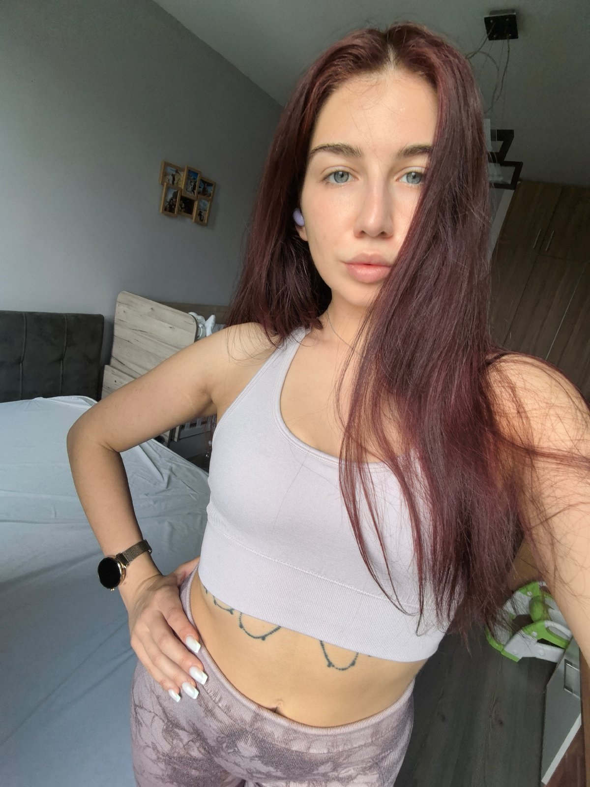 Woman takes multiple selfies indoors in Stara Zagora, Bulgaria