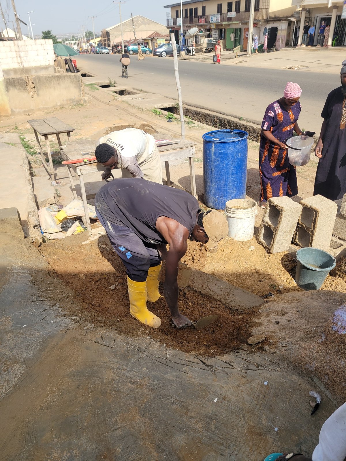 Construction workers renovate building in Jos, Nigeria
