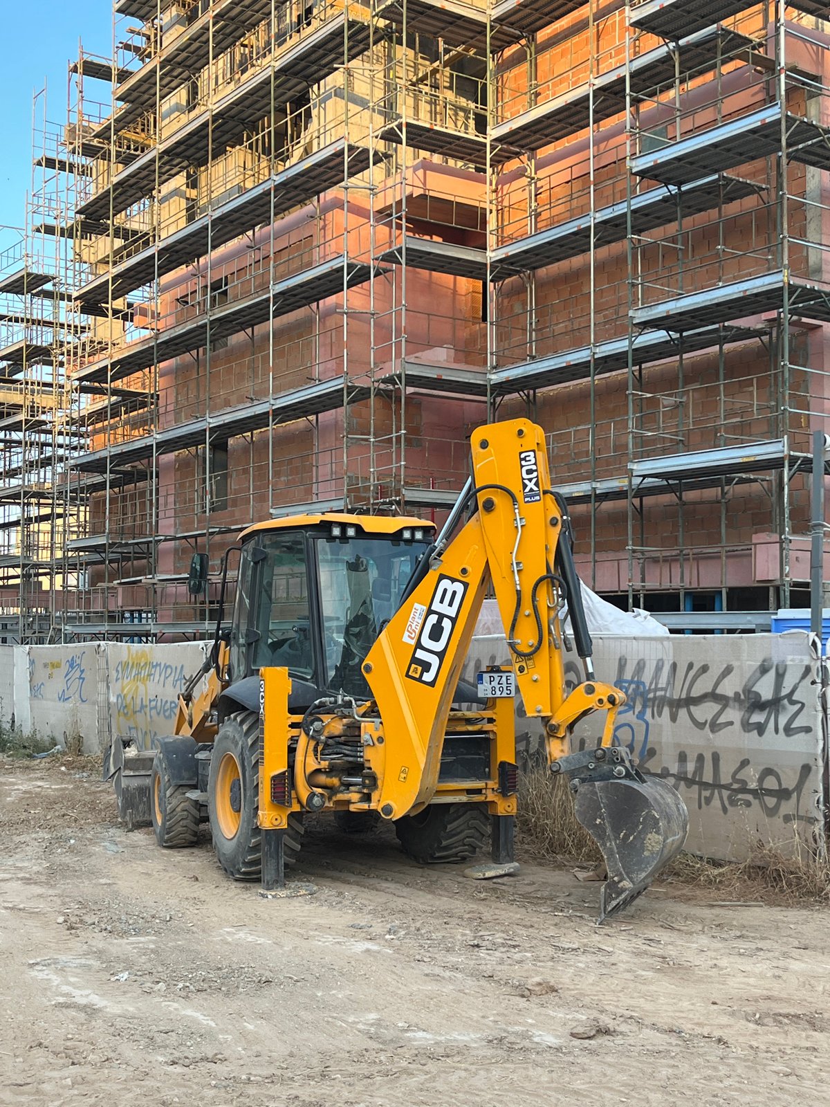 Limassol construction site visit with cat, car, palm trees