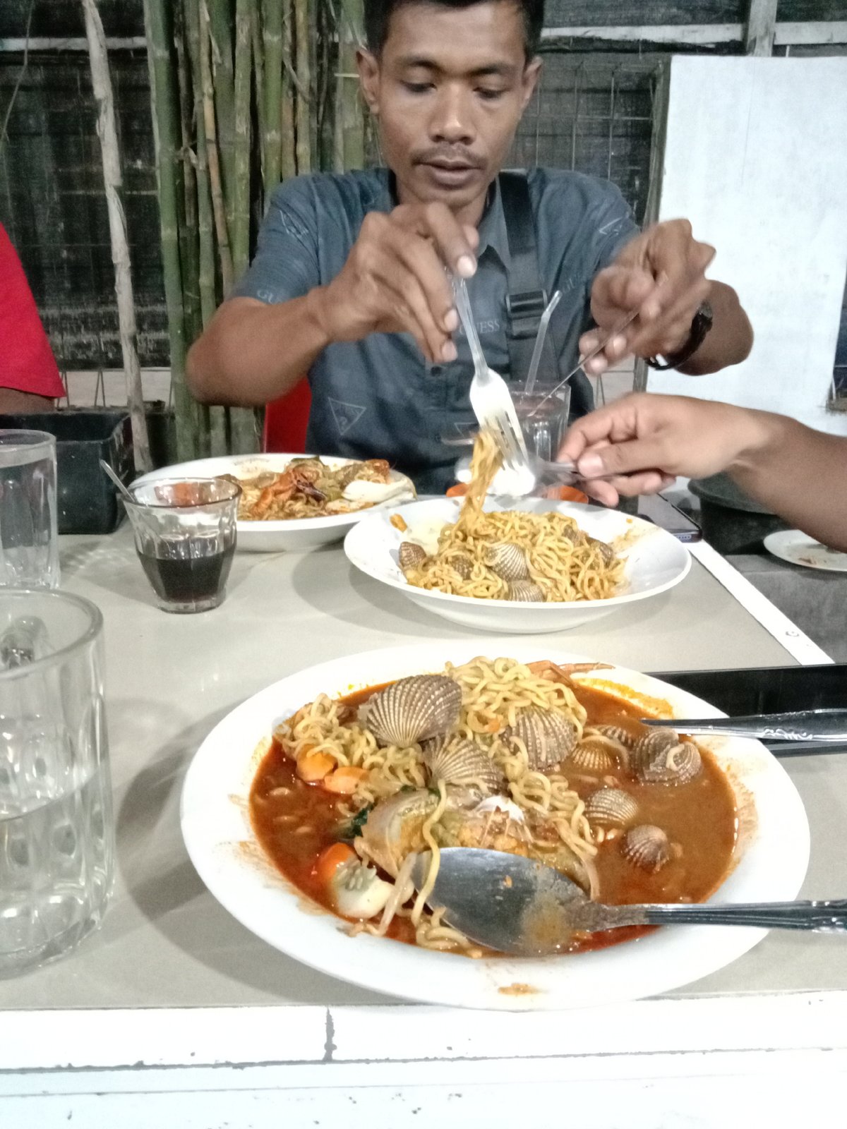 Evening cafe session with laptop and coffee in Lhokseumawe