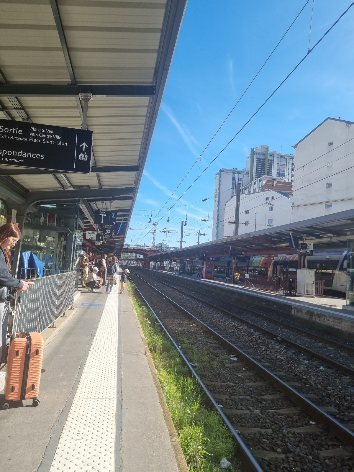 Passengers wait on train platform in Nancy, France