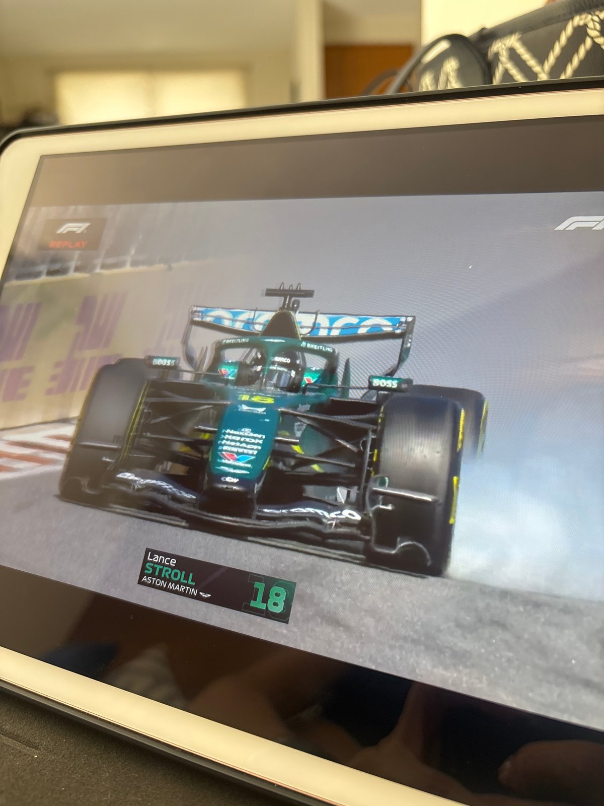 F1 replay showing Stroll's Aston Martin viewed in Puebla