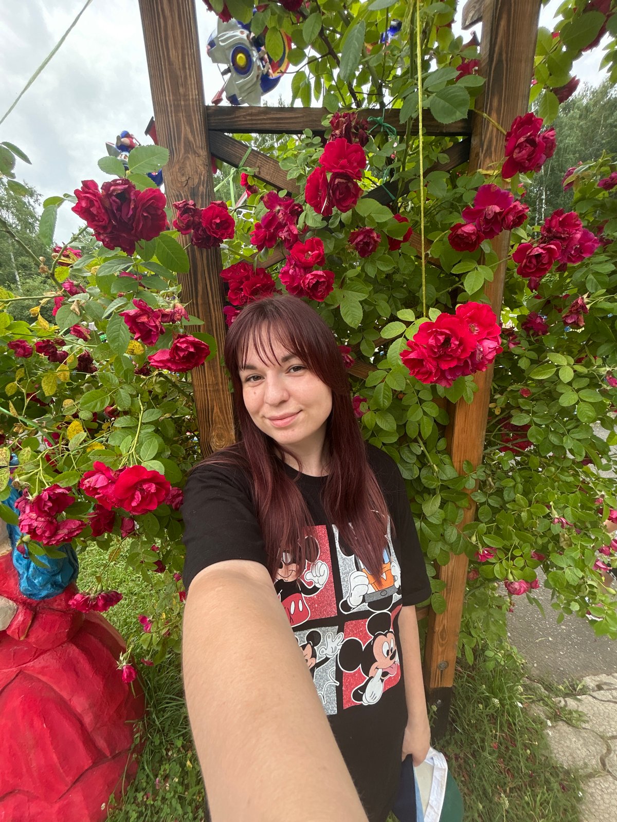 Summer amusement park day in Chaikovsky, rides and blooms