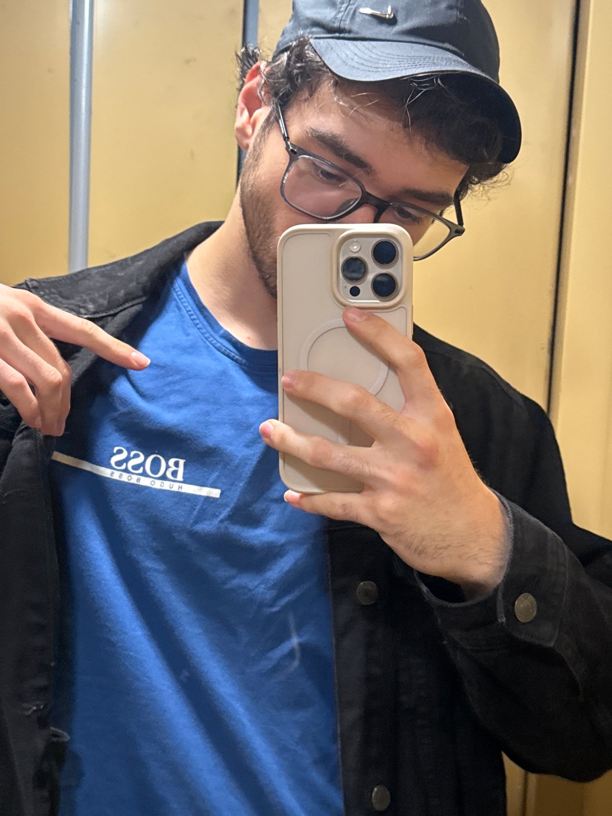Young man takes selfie, poses indoors in Blagoevgrad