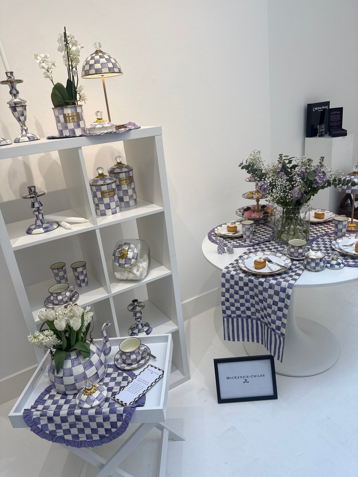 Purple checkered homeware display documented at London retail showroom
