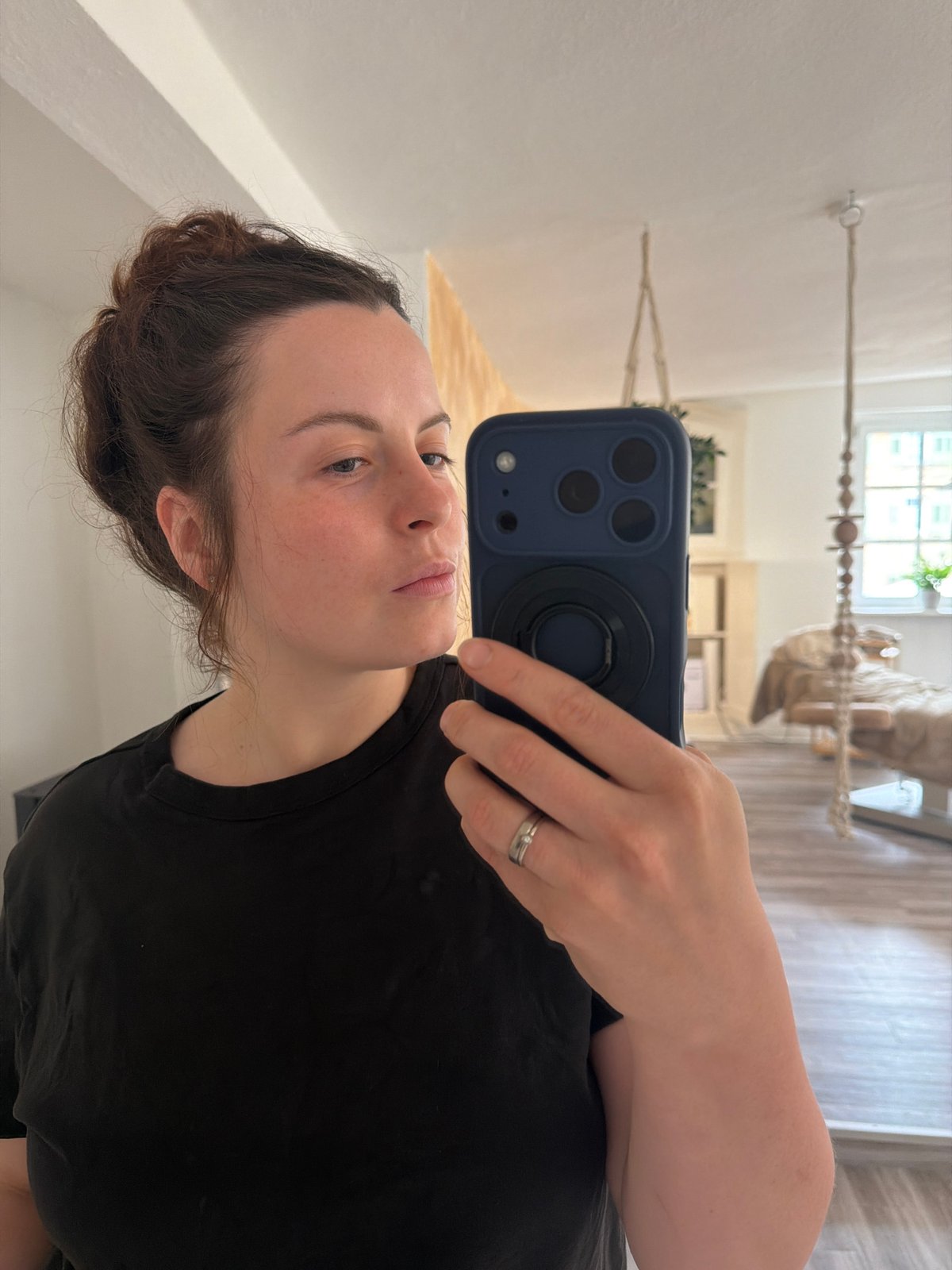 Woman takes casual selfies at home in Meisenheim