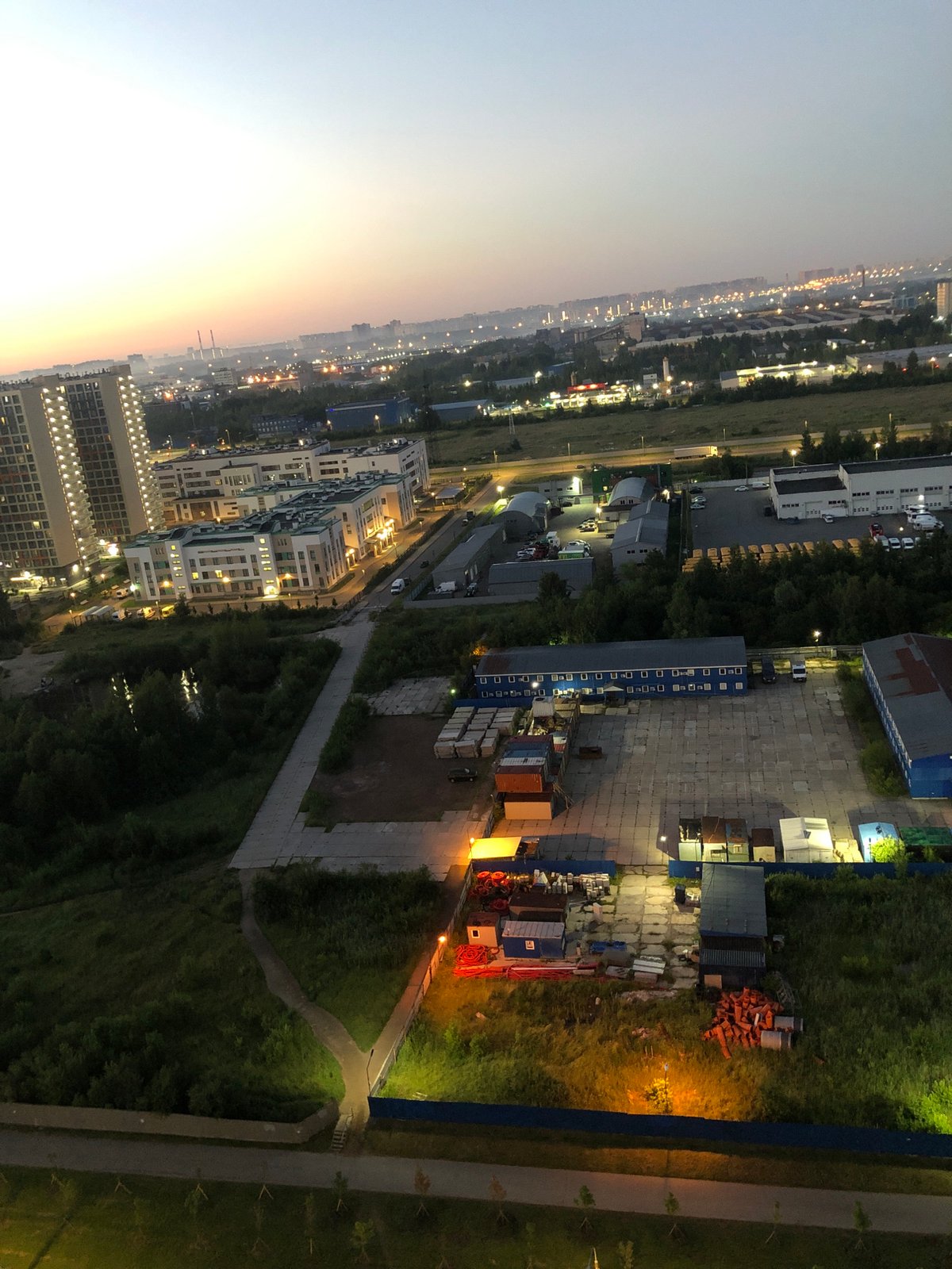 City skyline at dusk, aerial views and a cat on a windowsill