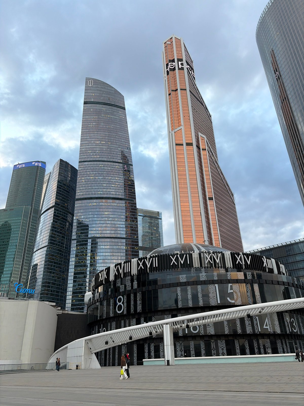 Modern skyscrapers and decorative clock photographed in Khimki, Russia