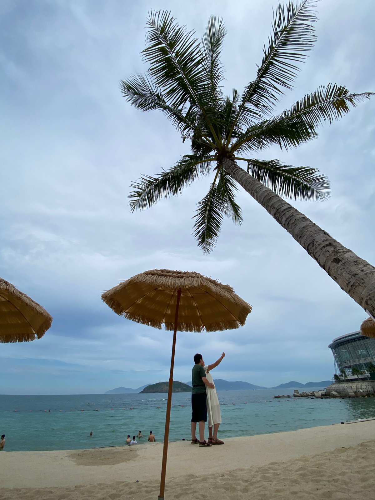 Laid-back morning on Nha Trang's beach under cloudy skies