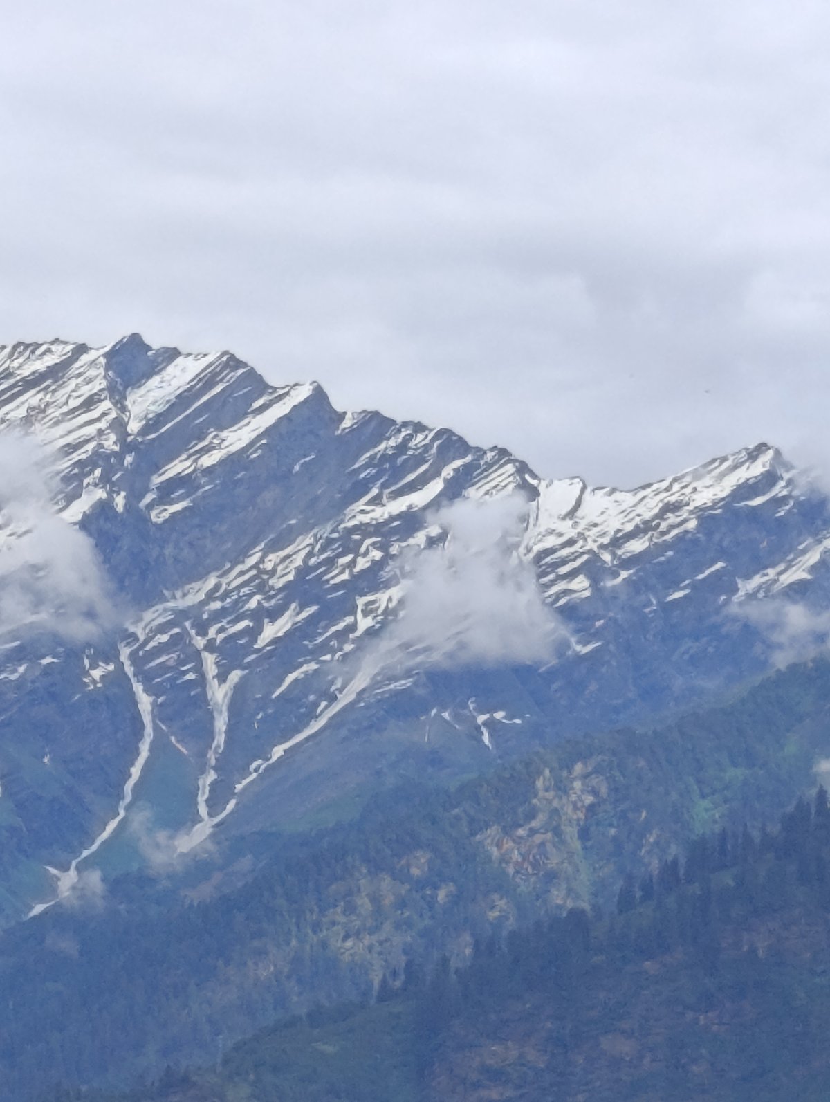 Snow-capped peaks and village life in Vashisht's mountain valley