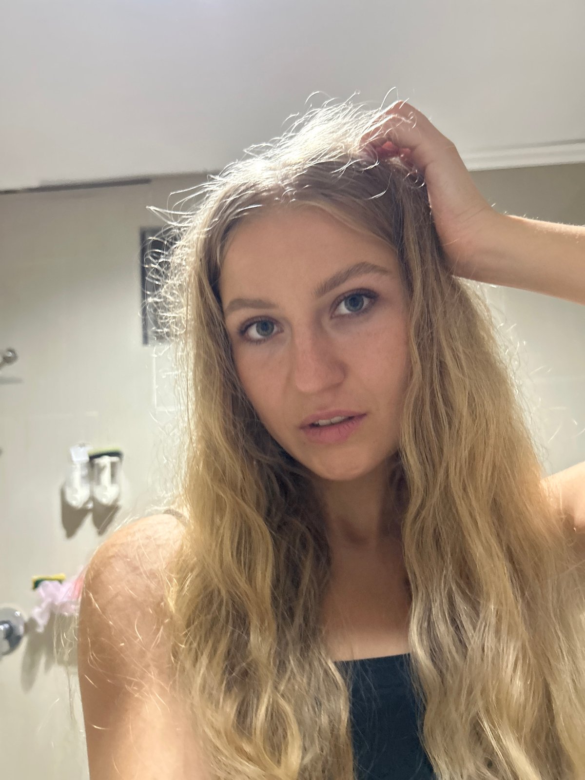 Woman takes bathroom selfies in Kuta Selatan, Indonesia