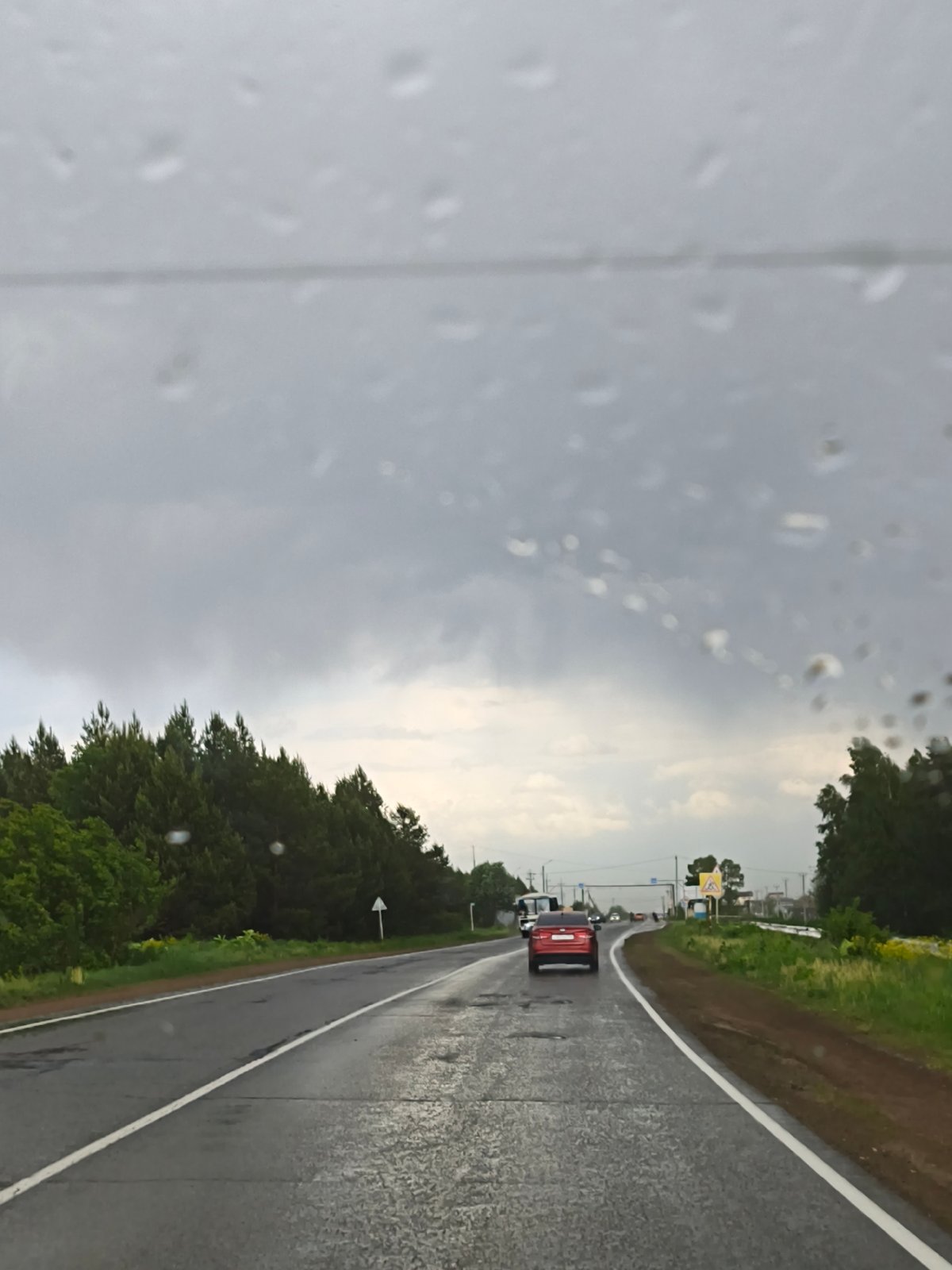 Rainy driving conditions observed in Prikamsky, Russia