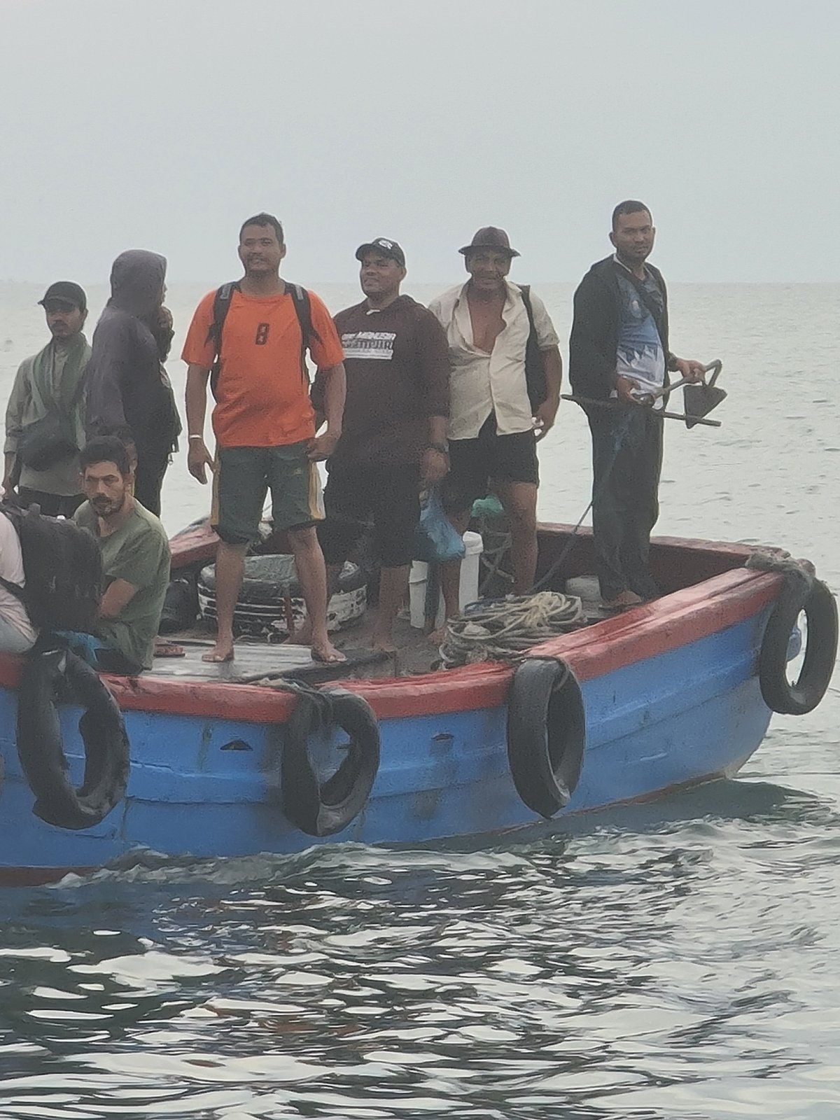 Evening fishing operations and market activity in Lhokseumawe, Indonesia