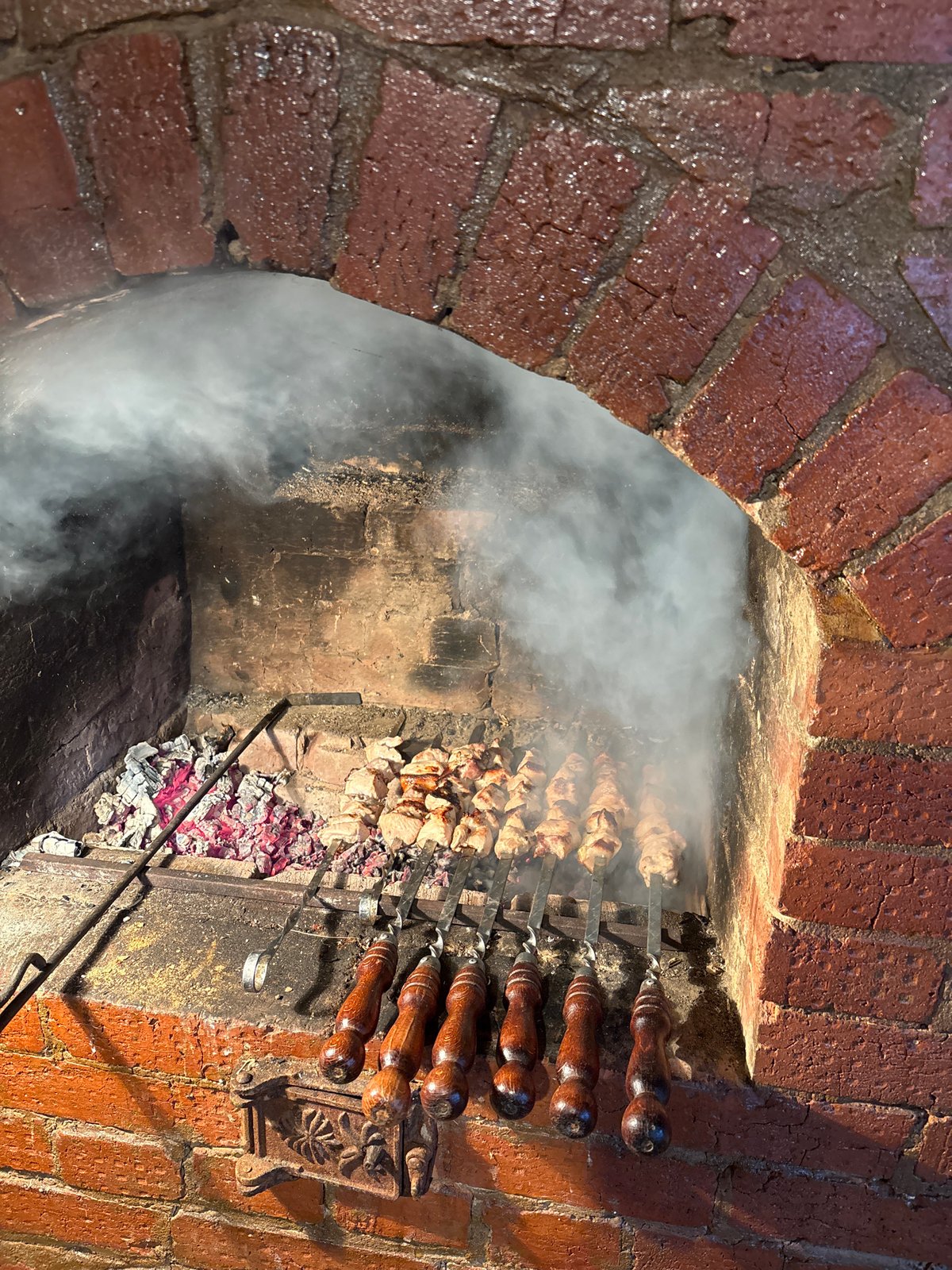 Rural cooking scene with brick oven in Алегазово, Russia
