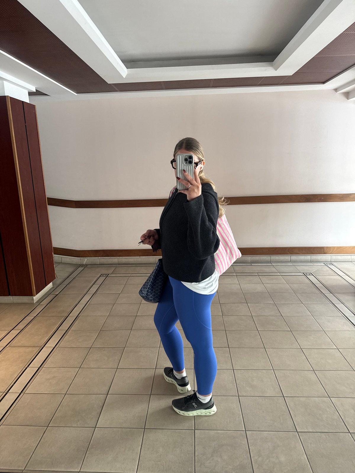 Person takes selfie in Paris building hallway
