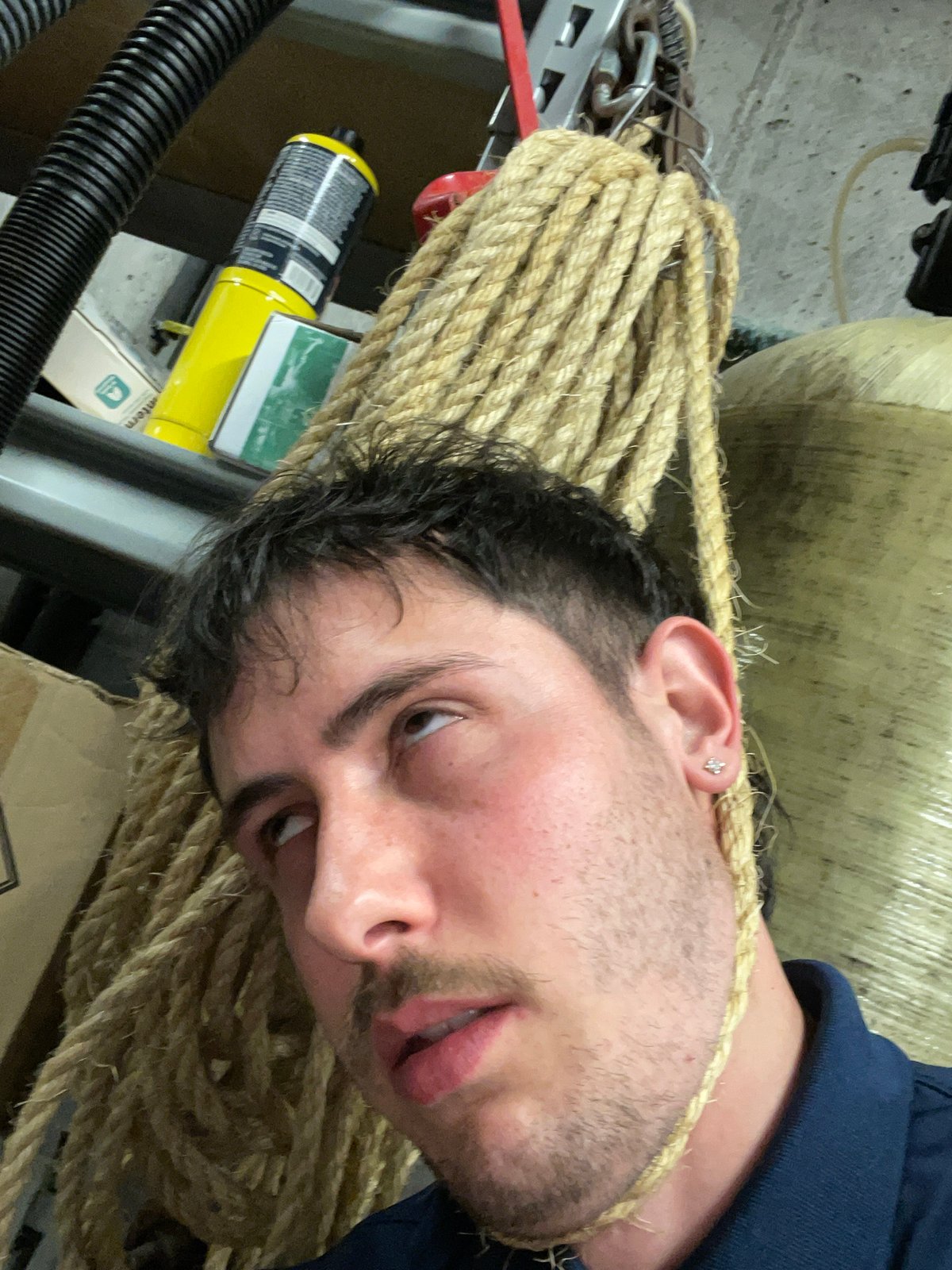Man resting on rope in Petoskey garage storage area