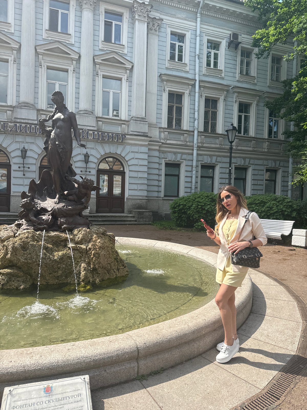 Morning selfie tourism captured around Saint Petersburg fountains and architecture