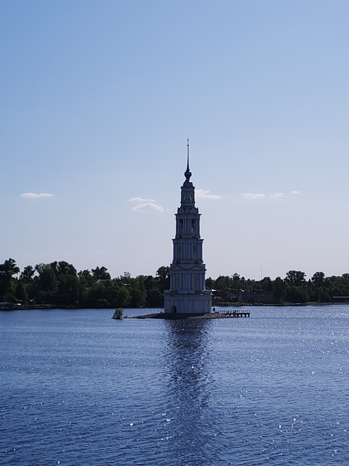 Tourist documents historic flooded bell tower from barge in Russia
