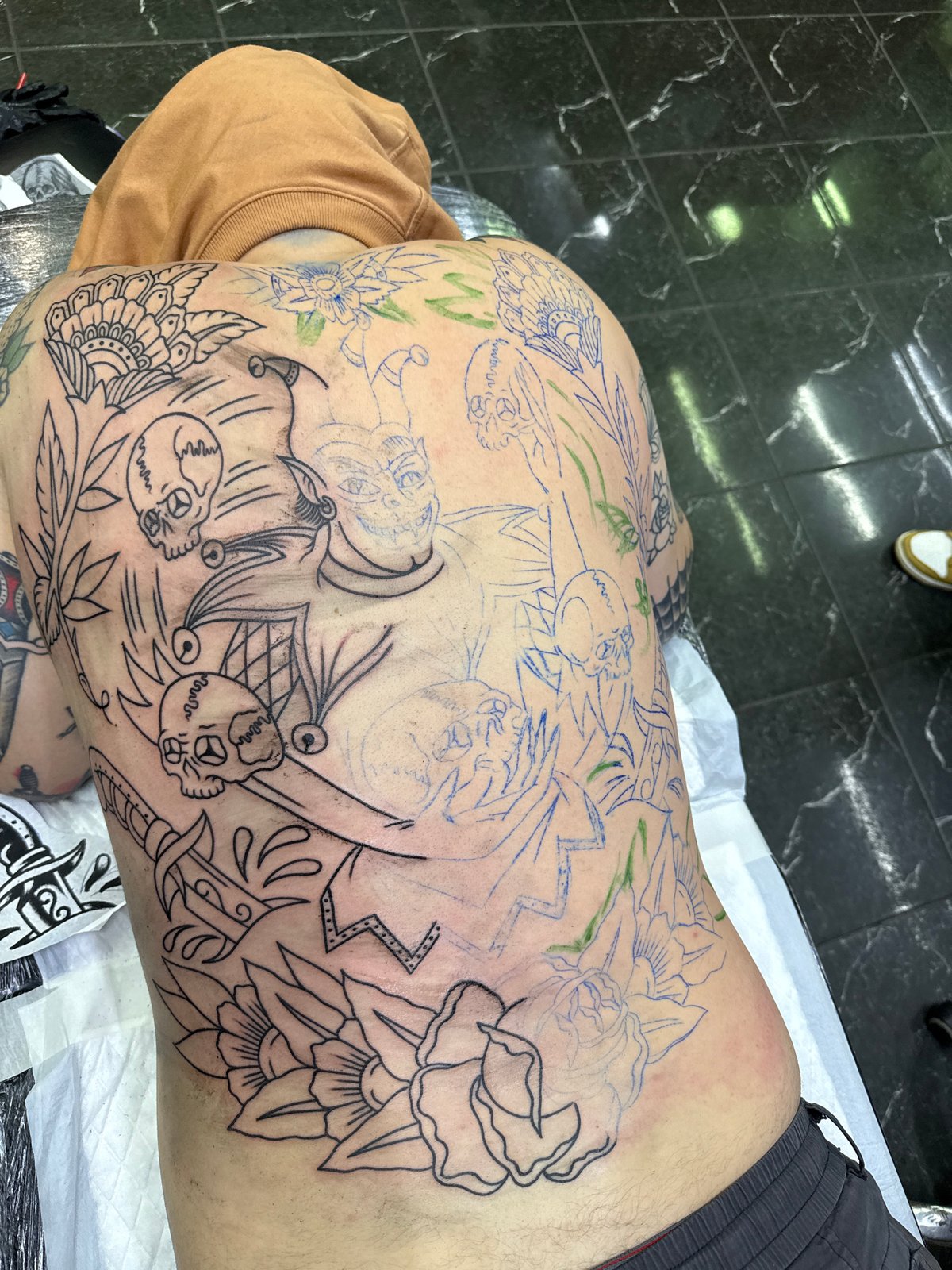 Tattooed individual observed resting in Moscow
