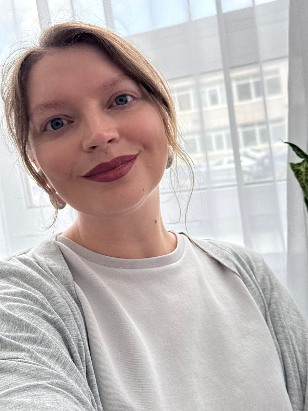 Woman in white outfit observed walking through Izhevsk morning