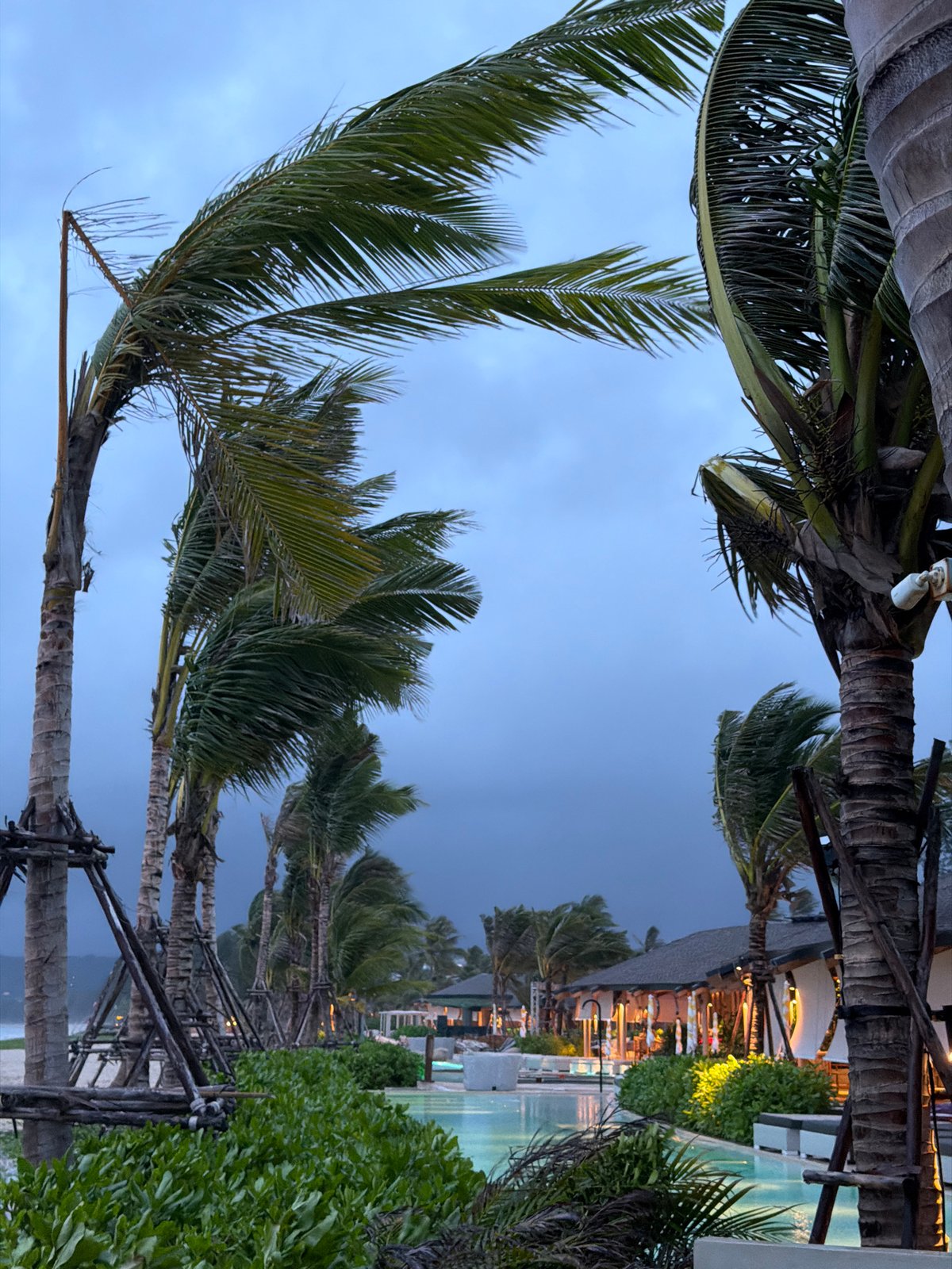 Beach activities continue under stormy skies in Choeng Thale