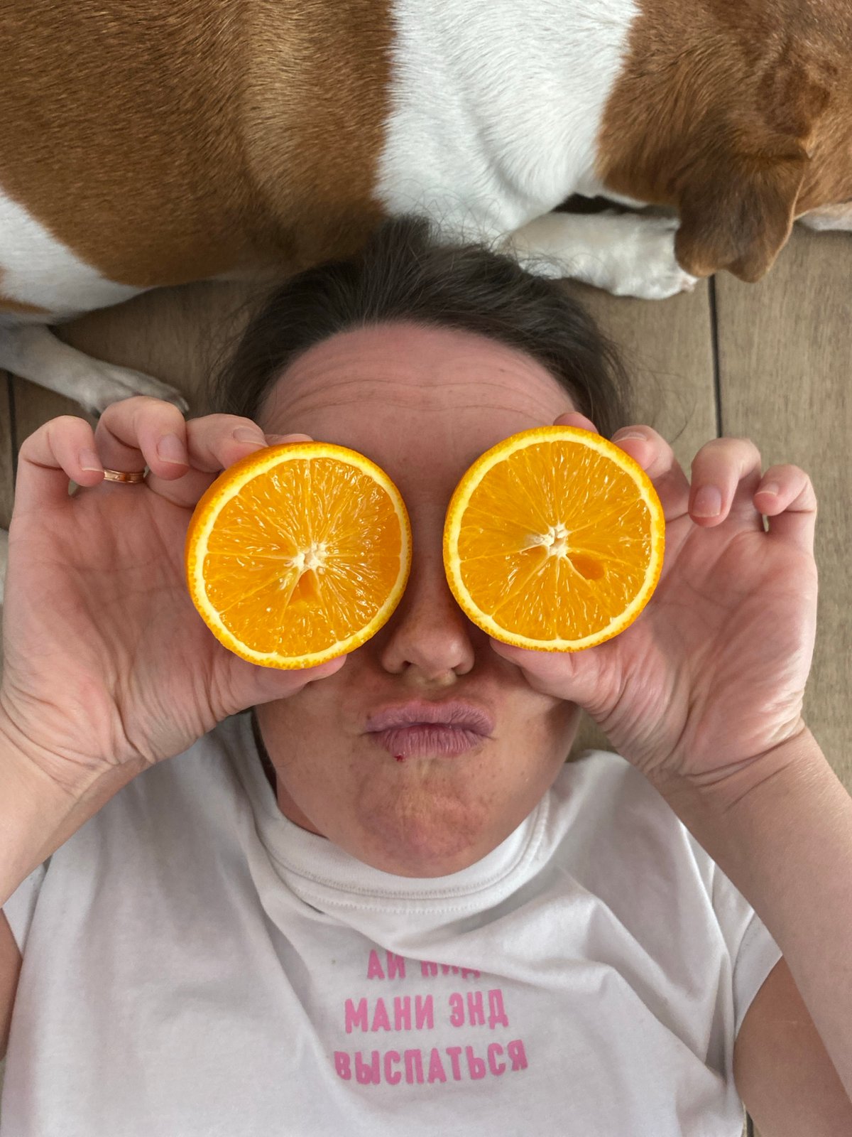 Woman poses with oranges over eyes in Chaikovsky