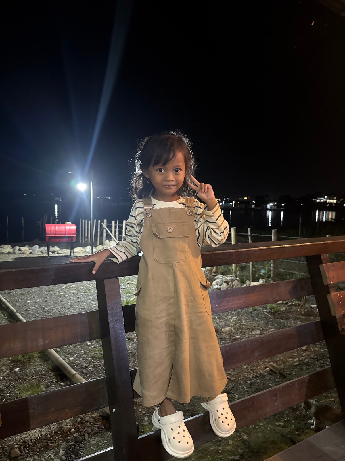 Nighttime hangout and phones in Kalalengkio, Indonesia