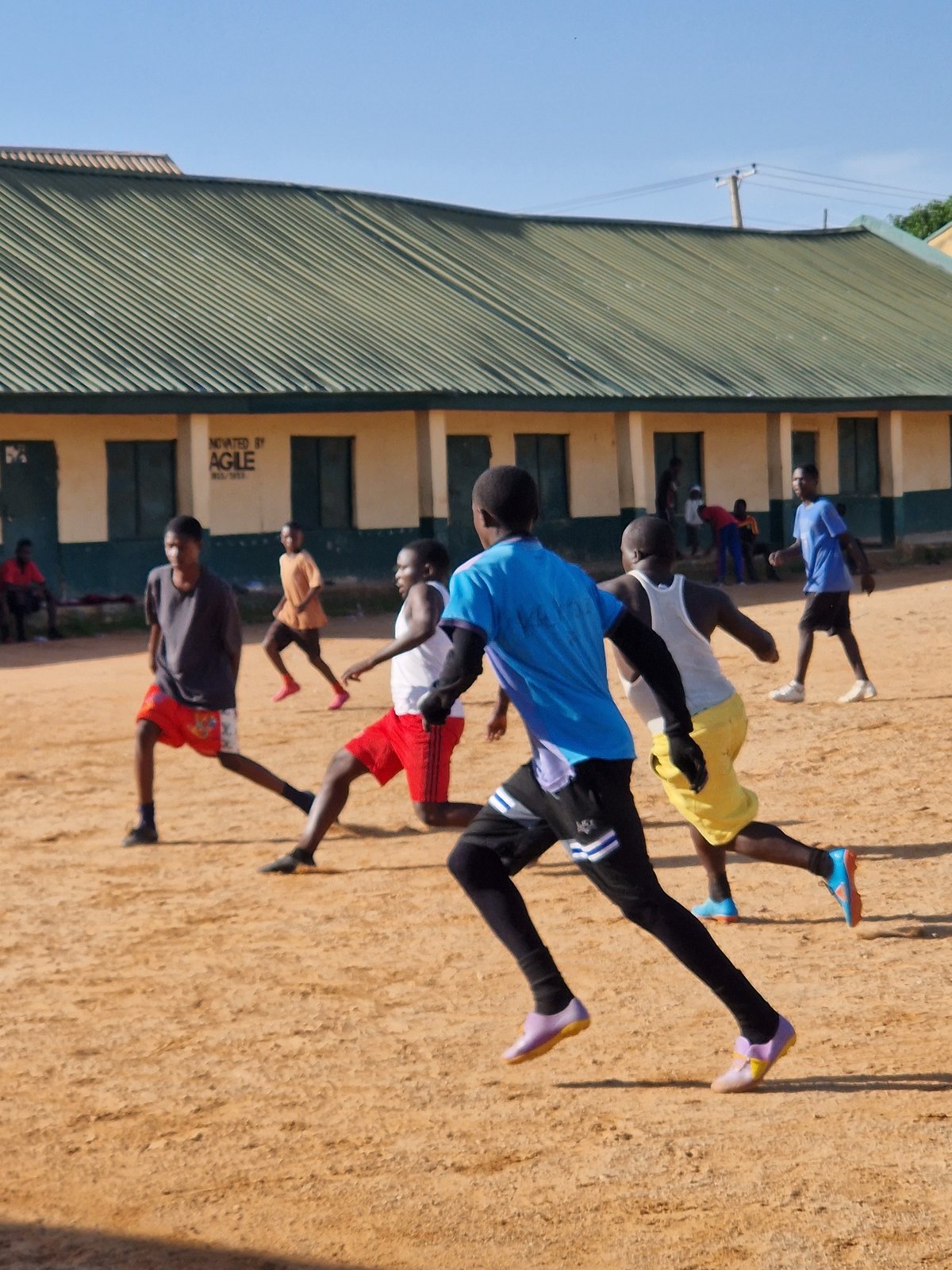 Morning life in Kabong: football, water fetching, and street activity