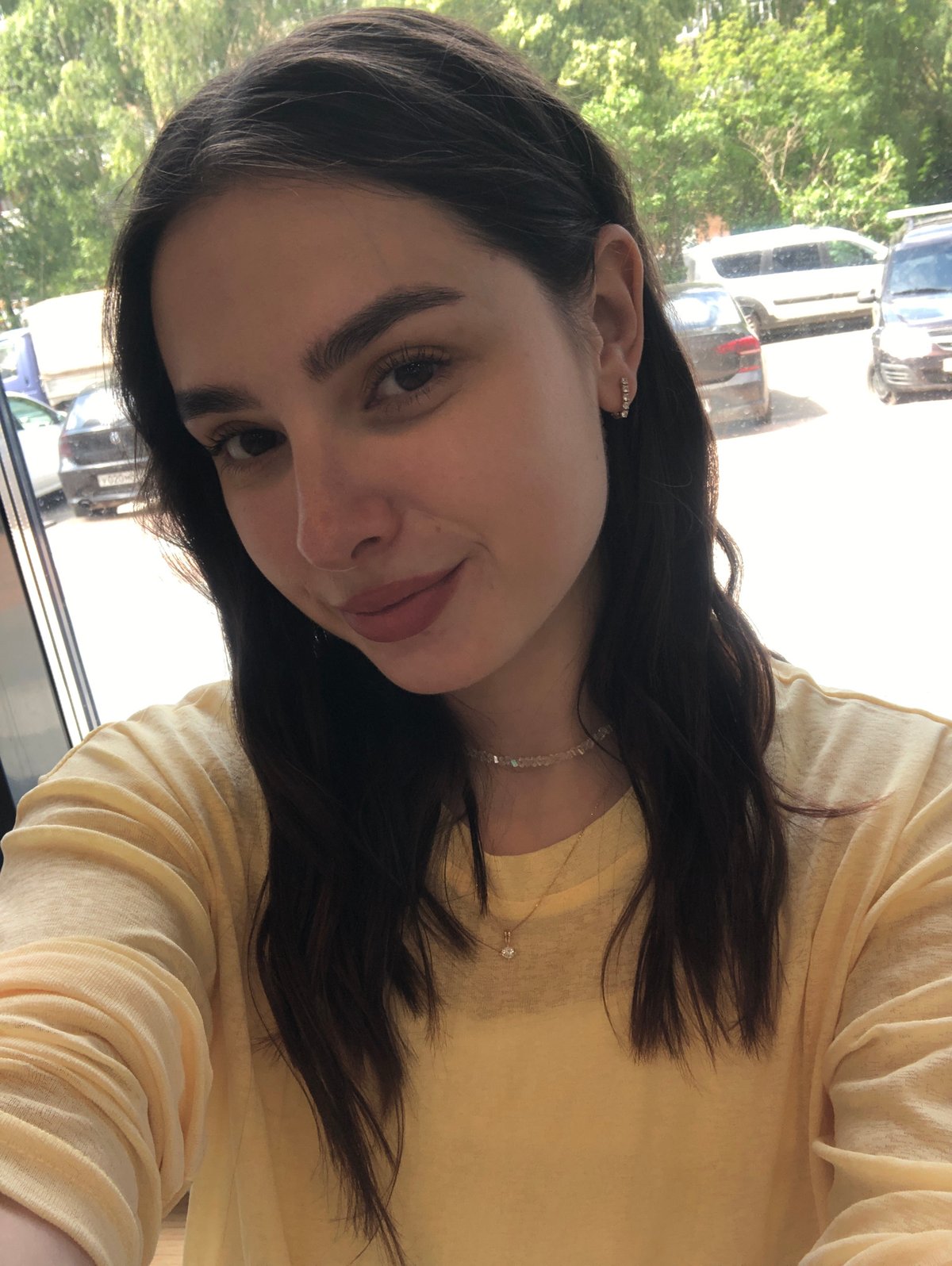 Café selfie session in Izhevsk, yellow top, multiple angles
