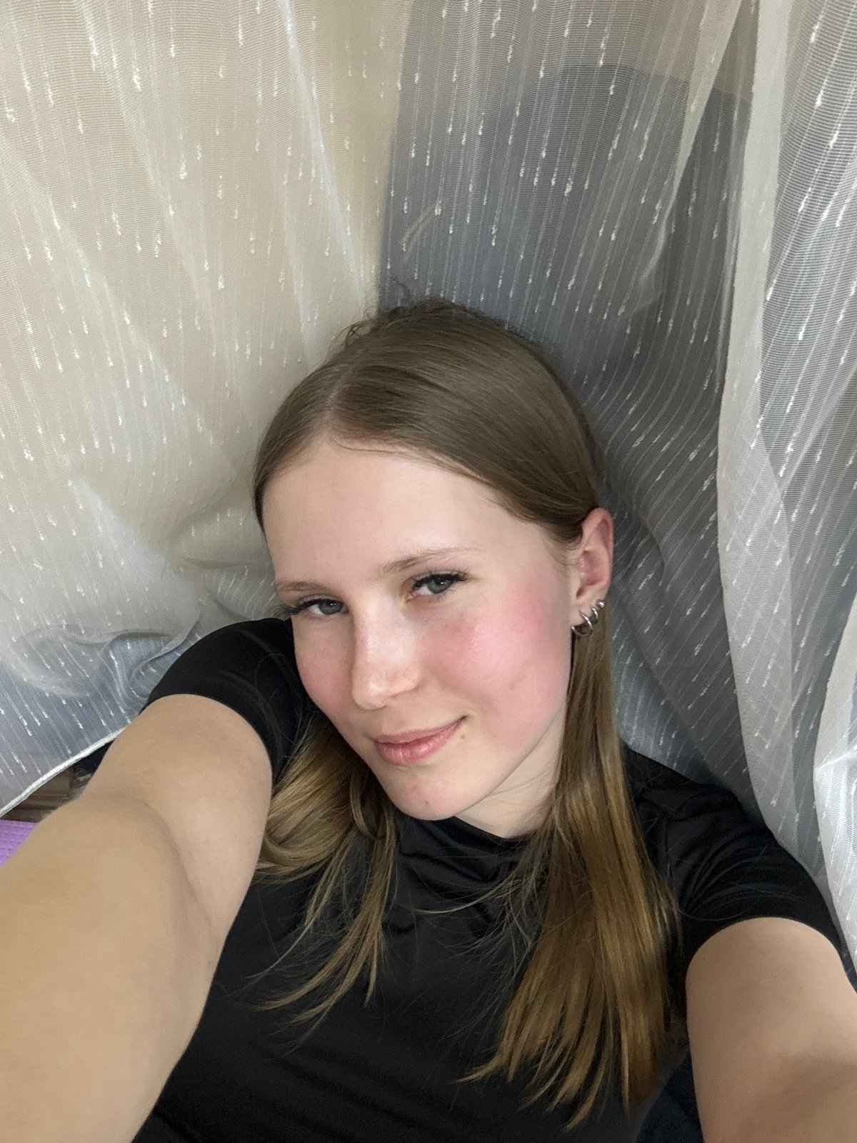 Woman observed resting under fabric in Berezniki, Russia
