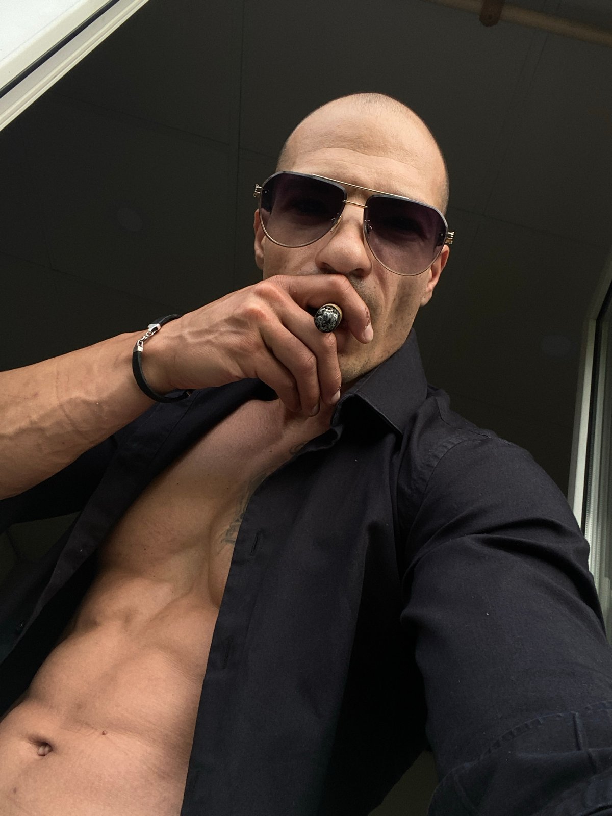 Man photographs himself smoking cigar in early morning Pleven