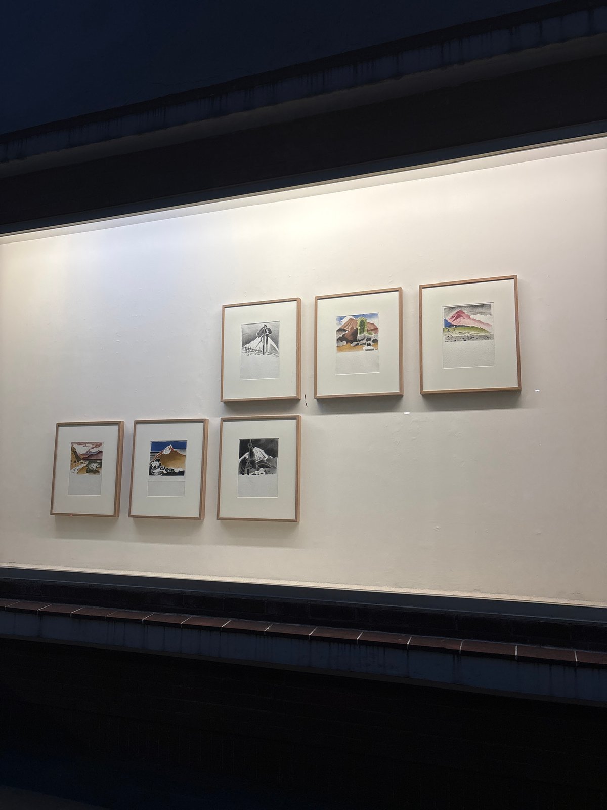 Framed artworks displayed on wall in Mexico City interior