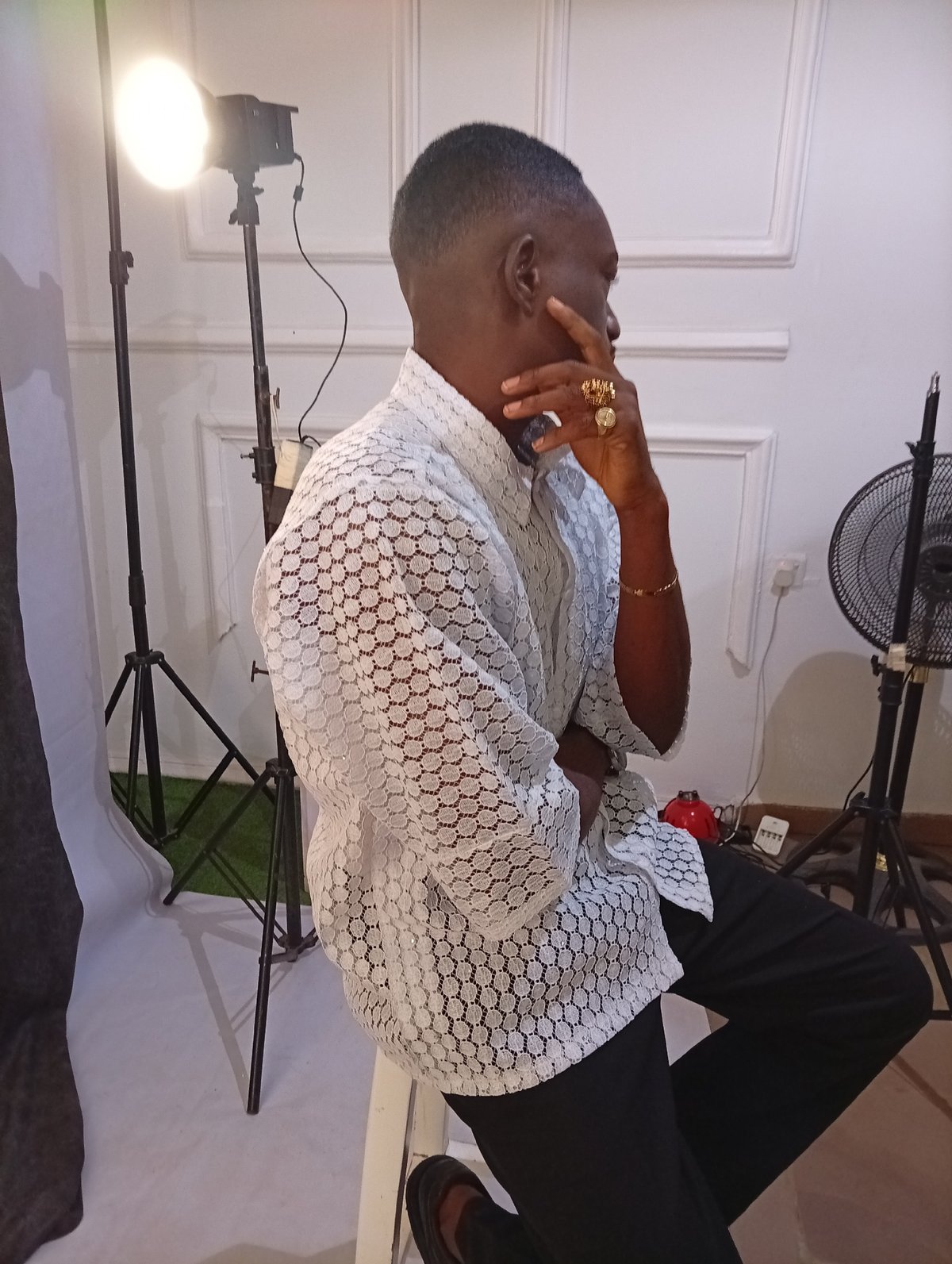 Man poses for professional photography session in studio
