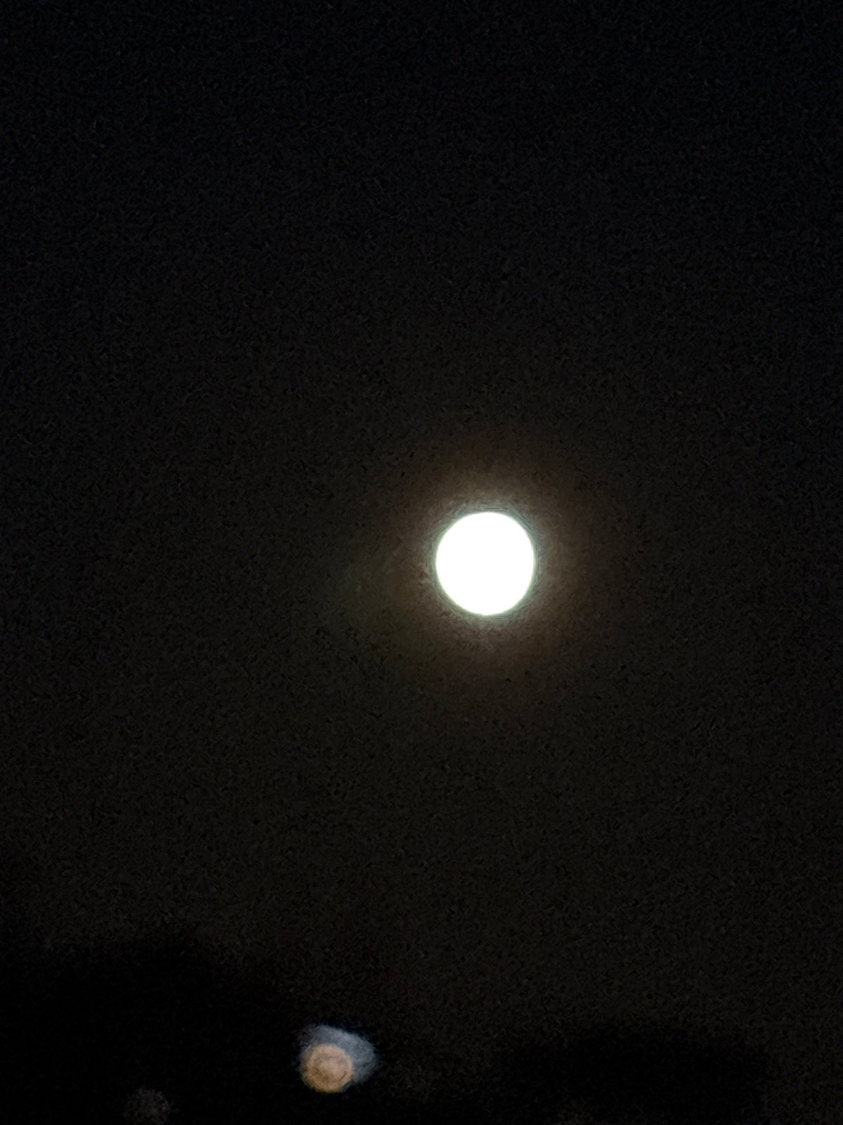 Bright moon observed in night sky over Chaykovsky, Russia
