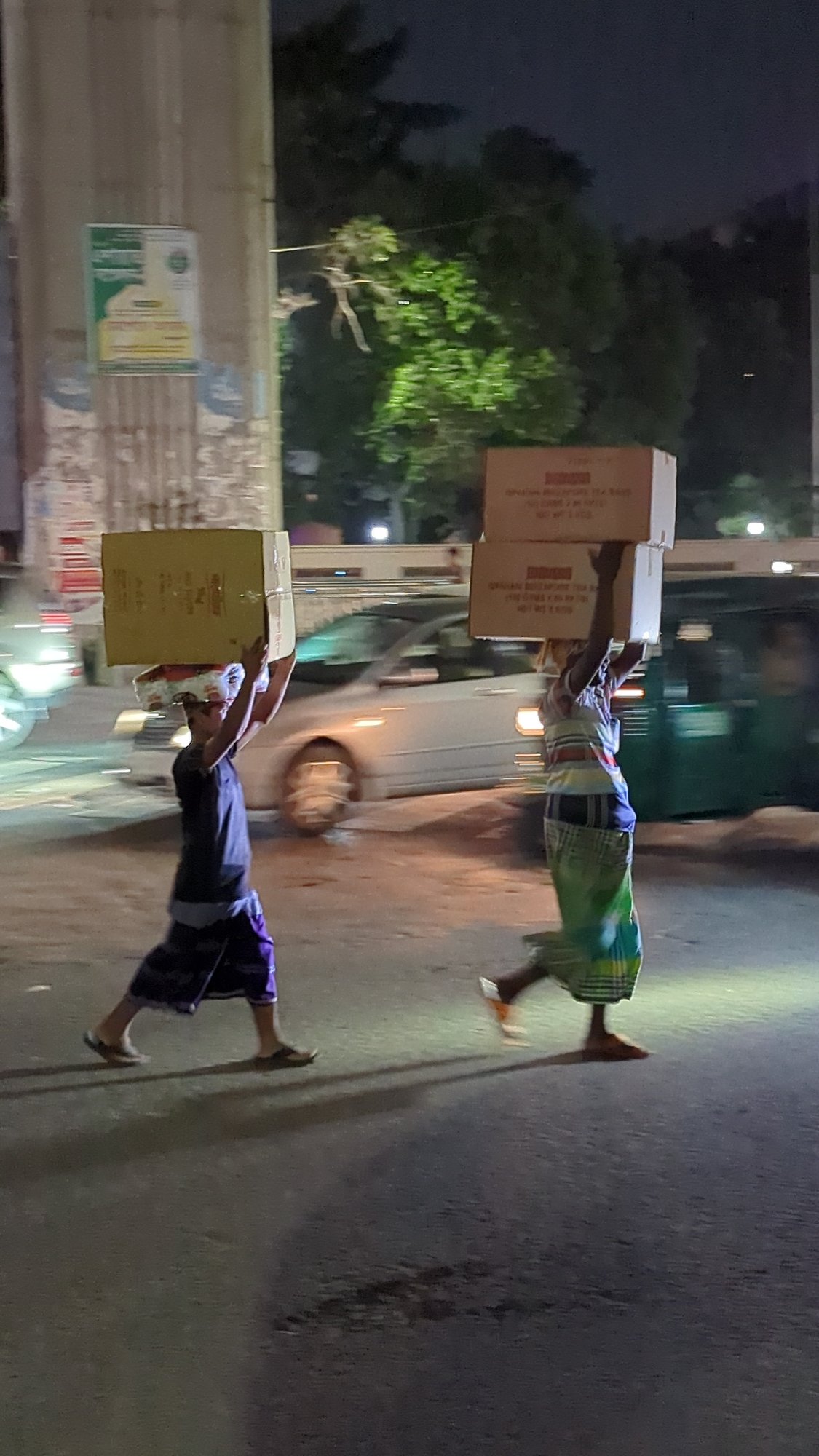 Workers conduct nighttime construction, maintenance tasks in Dhaka
