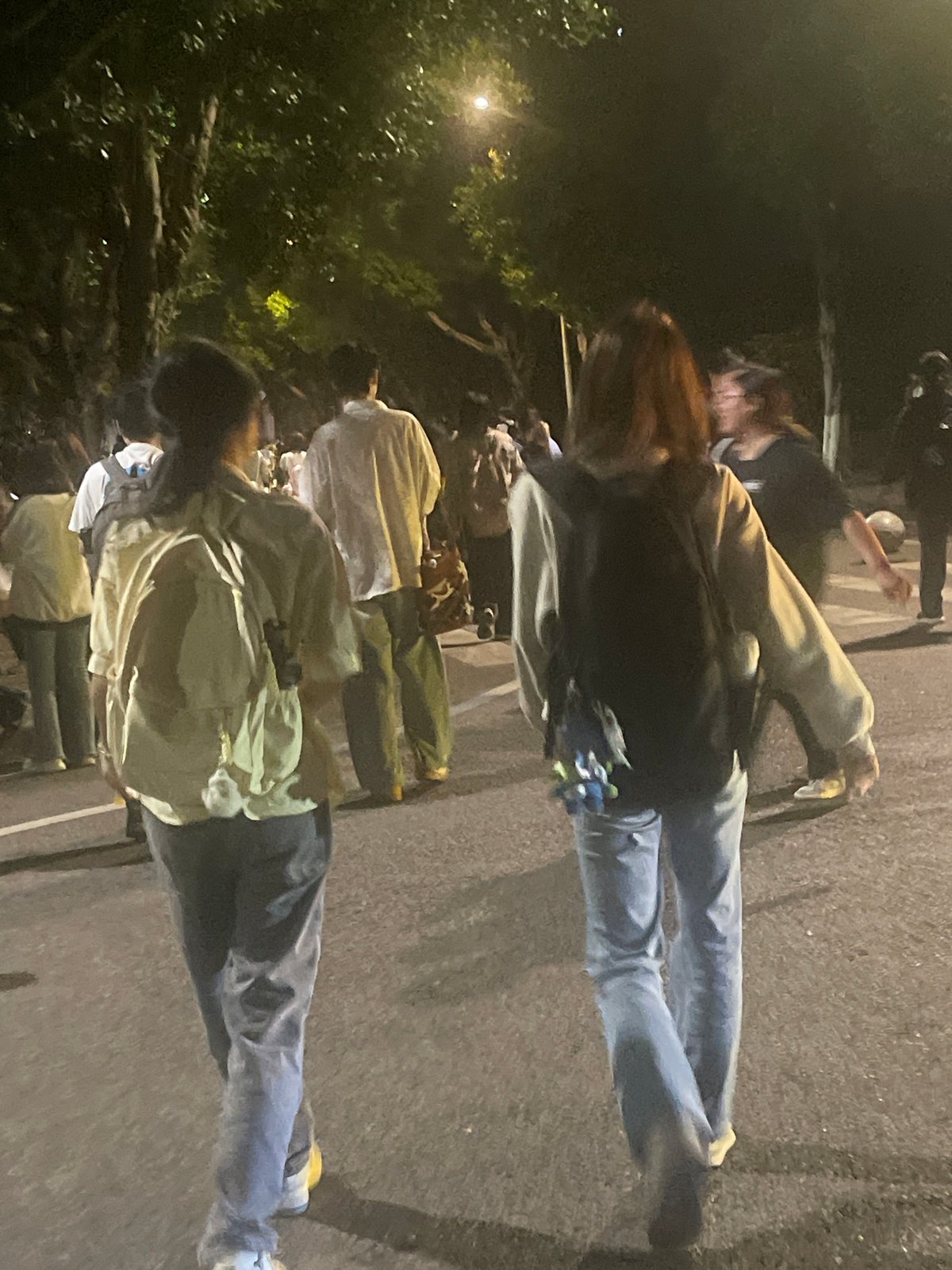 Evening pedestrians captured on Chongqing High-tech Zone streets