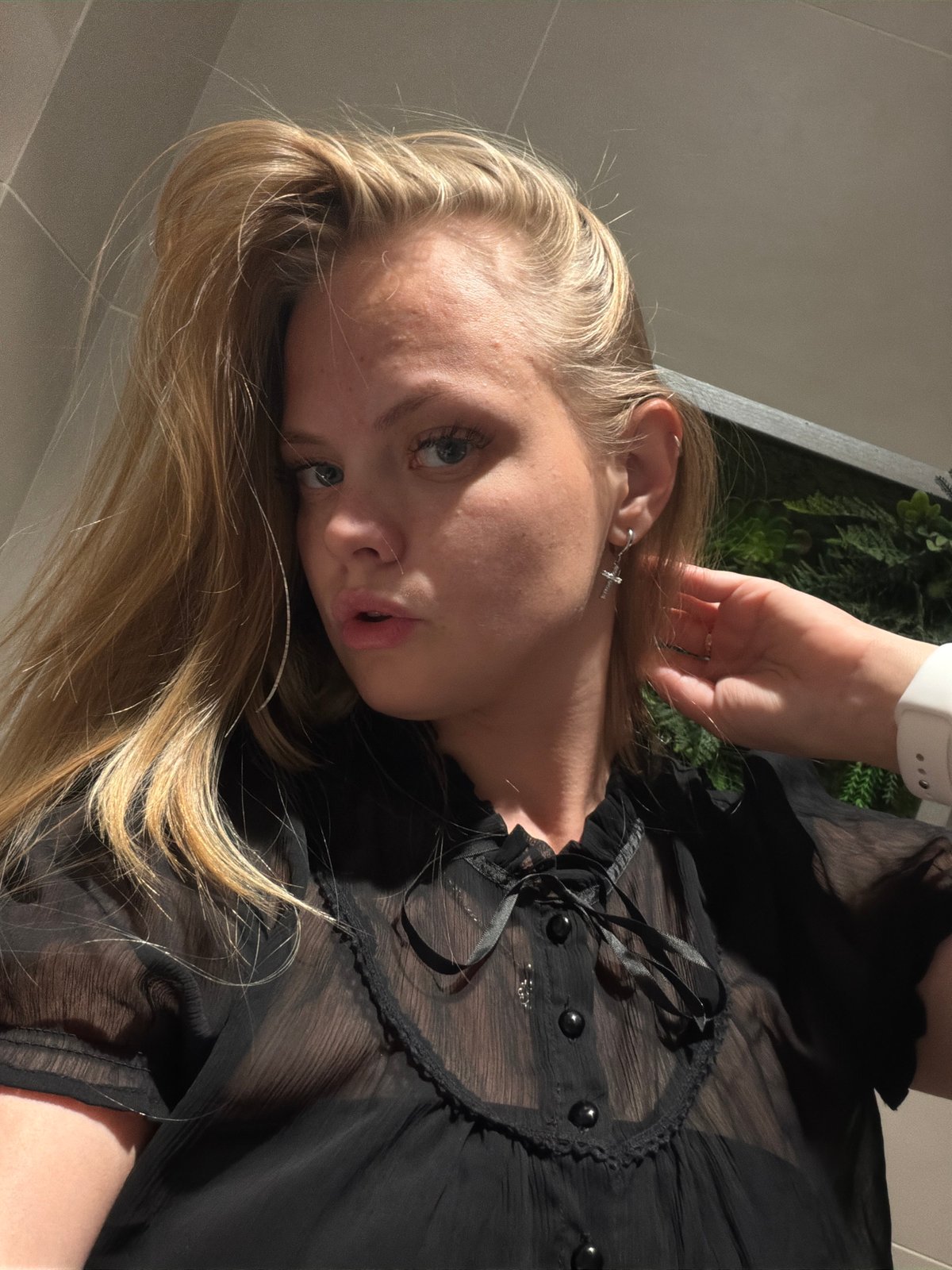 Outfit selfie session in an Izhevsk public restroom