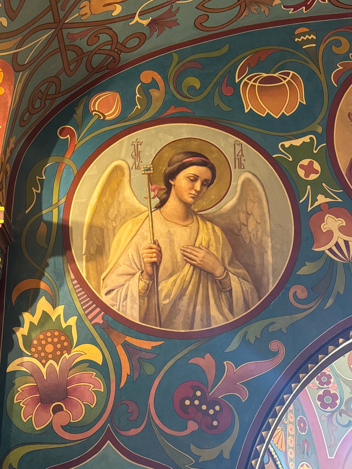 Visitor documents ornate interior of Saint Petersburg Orthodox church