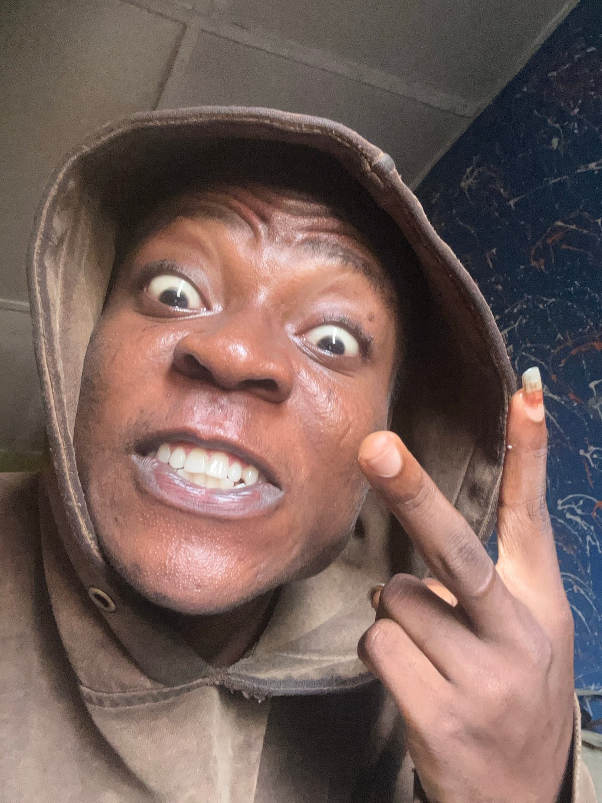 Person in brown hoodie captured in animated photo session
