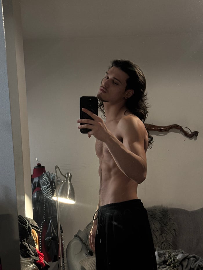 Young man photographed in multiple indoor poses in Sofia